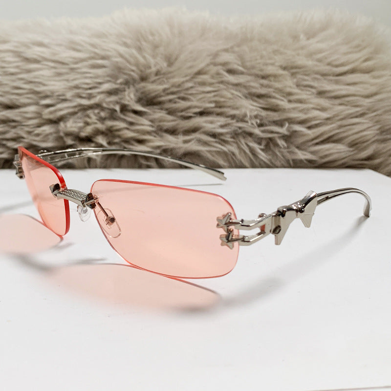Nashi Pear 90325 oval sunglasses, nickel frame with translucent pink-red lenses, single pair