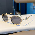 Nashi Pear 98135 round sunglasses, Gold frame with dual gray lenses