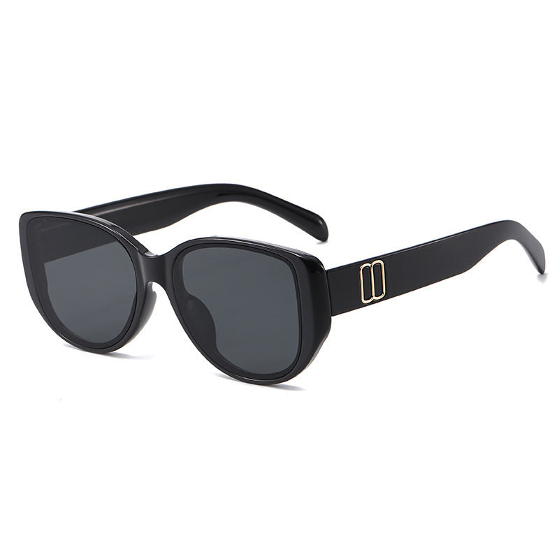 Nashi Pear T52P cat-eye sunglasses, black frame and gray lenses, single pair on white
